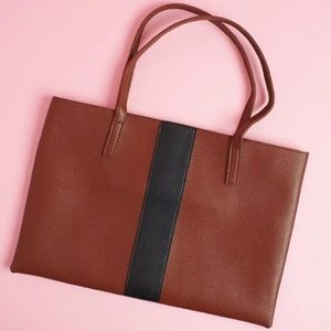 Vince Camuto Luck Tote in the color “red desert.”